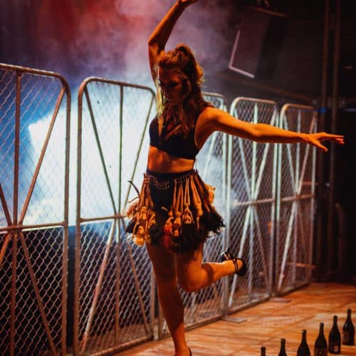 Jess Mews walks on champagne bottles
